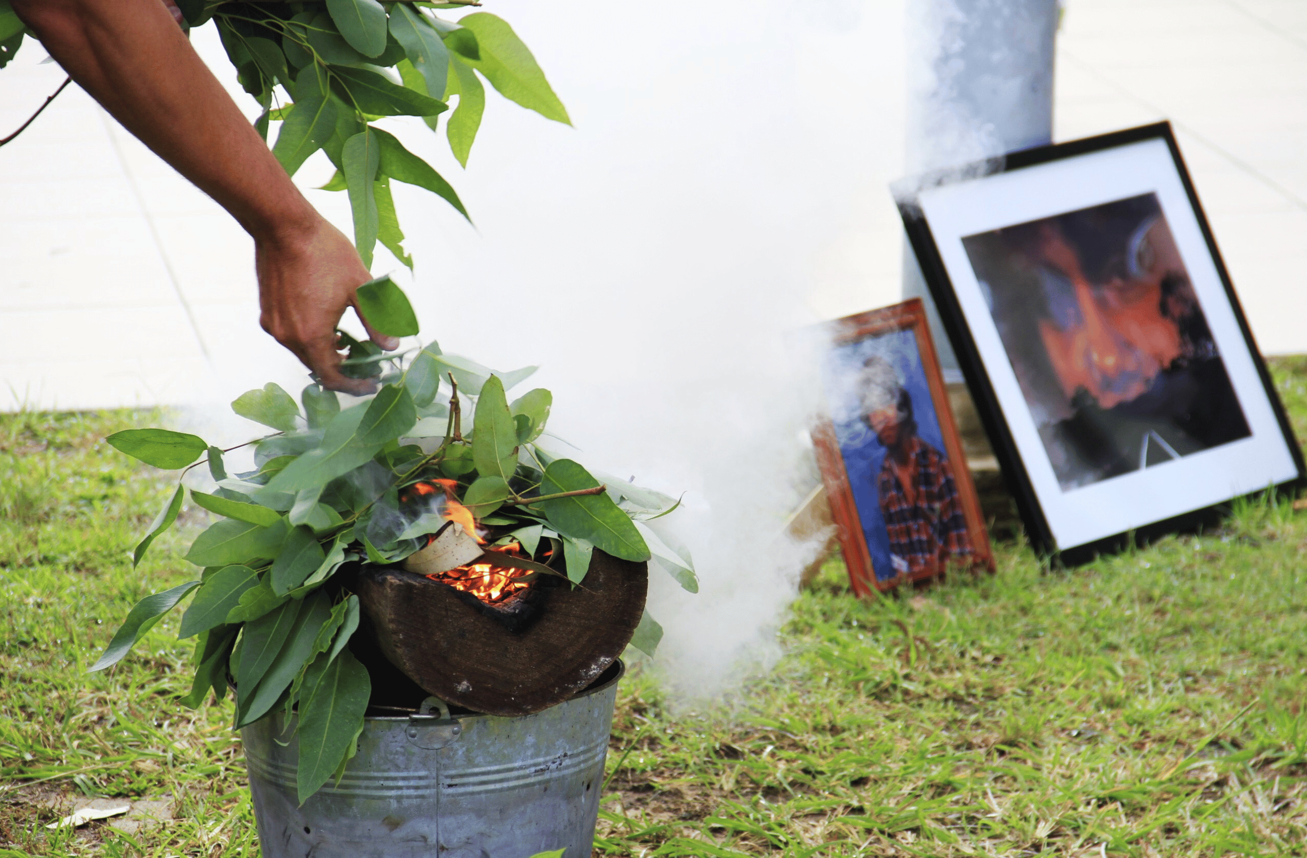 Framed photos of Mark Haines at smoking ceremony