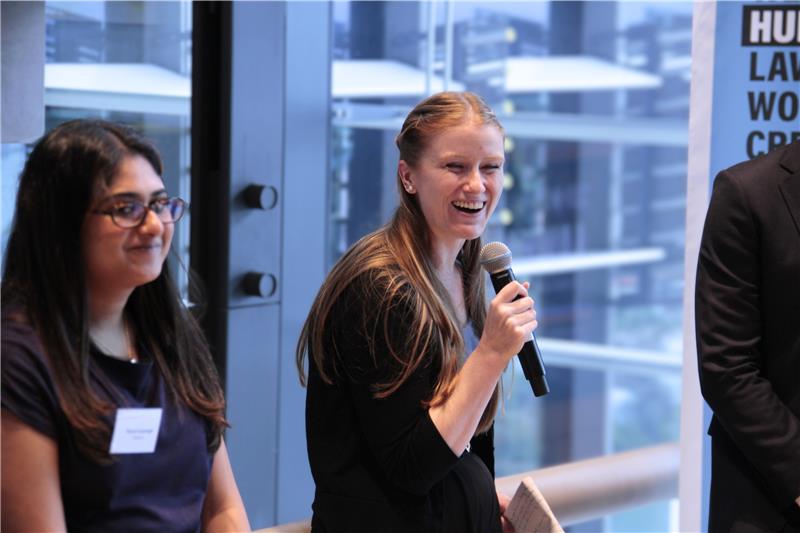 Speaker uses microphone at LawHack 2026