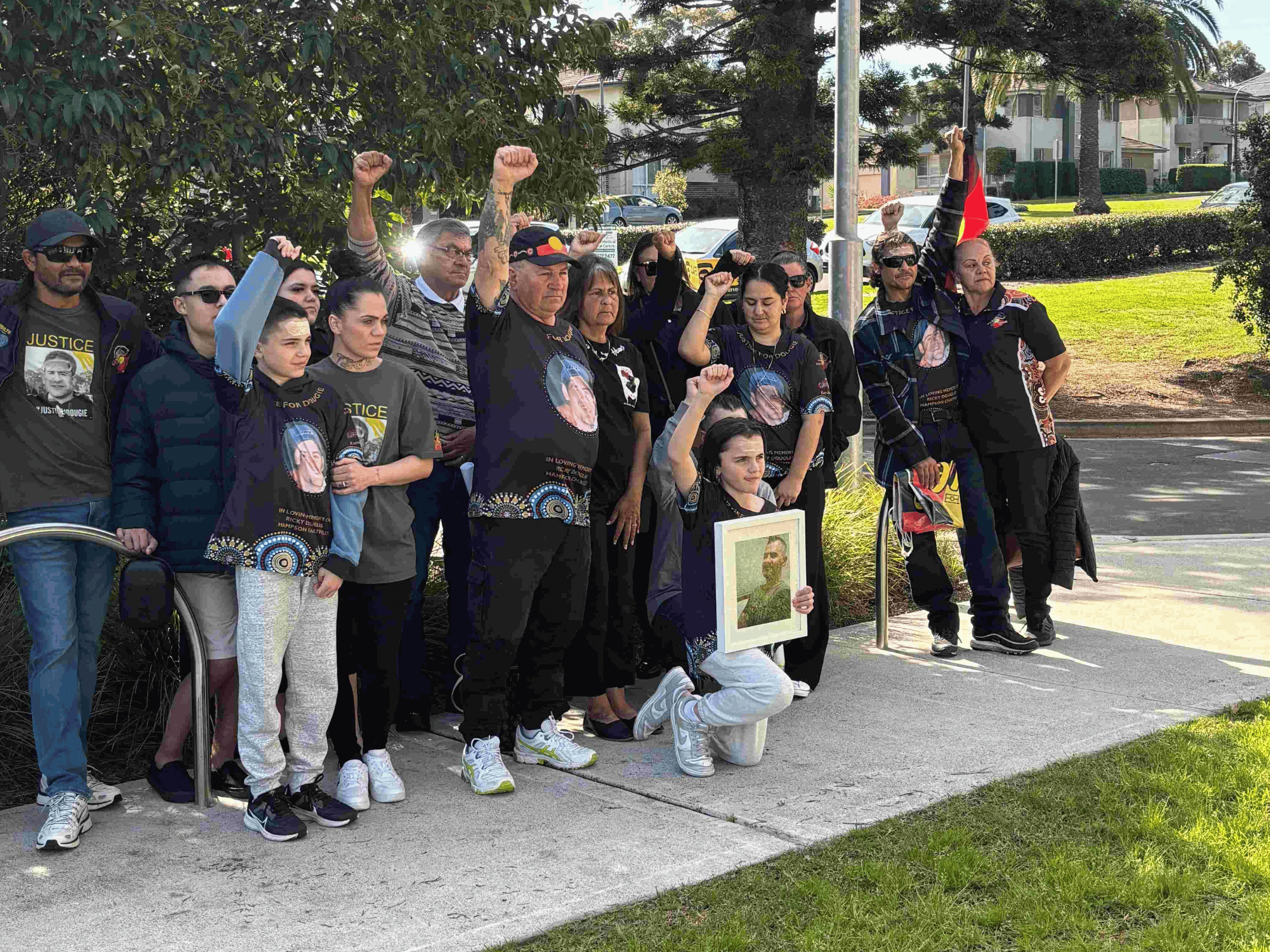 Dougie Hampson family with fists held high at inquest findings